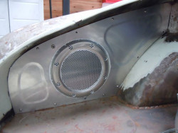 Engine bay panel with hidden fan to draw heat out