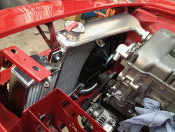 Radiators sloped top tanks to aid water flow