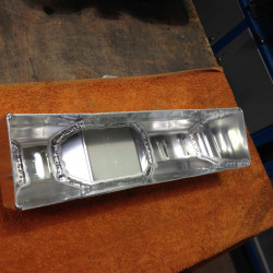 Forming replica radiator top tank.