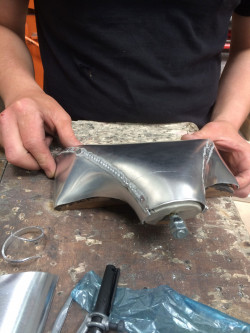 Knocking blocks for end tank manufacture