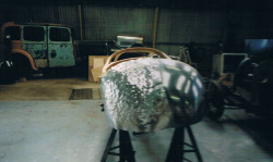 Roughly beaten left panel next to wheeled and finished right panel