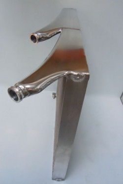 Shaped end tanks to improve flow. Wiggins Ferules